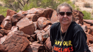 Raelene Cooper and hand petroglyph