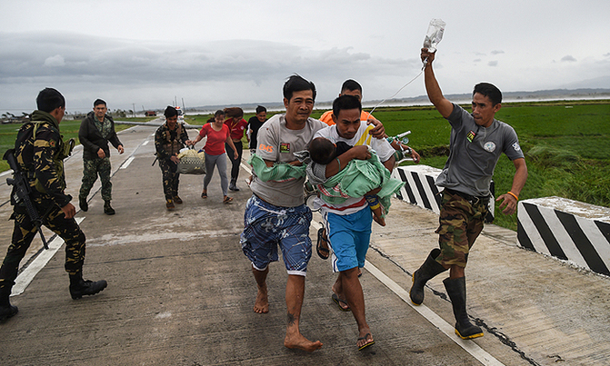 Grim search for typhoon landslide victims as Philippines toll climbs Grim search for typhoon landslide victims as Philippines toll climbs