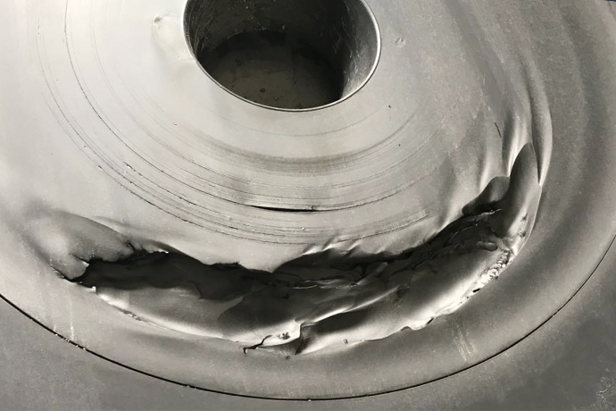 In a mill discharge pump, this non-OEM frame plate liner insert (FPLI) failed catastrophically and caused an emergency shutdown of a ball mill. A genuine Warman® pump part safely doubled the wear life.