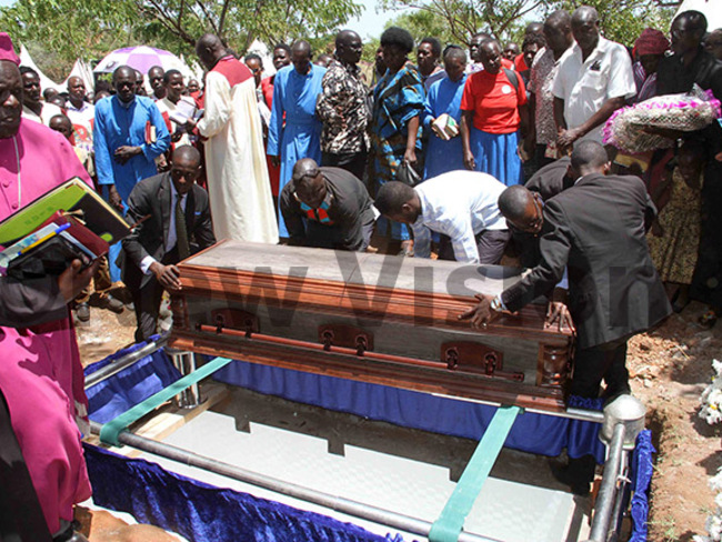  ngoms casket lowered to his final resting place hoto by udson punyo