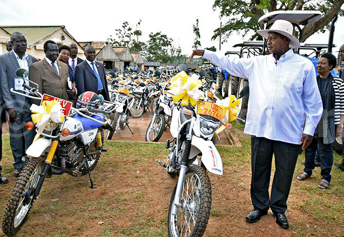  resident useveni looks at some of the motorcycles at the launch and hand out of  heavy machinery tractors motor vehicles and motor cycles to agriculture extension workers for agriculture transformation hoto by iriam amutebi