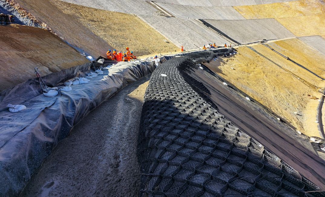 An example of slope stabilisation utilising a combination of shotcrete and geosynthetic materials