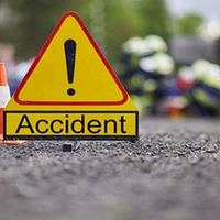 Head-on collision between two lorries; Three including both drivers dead