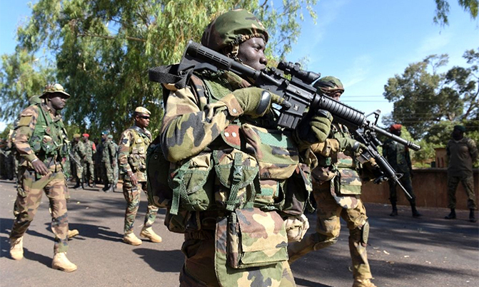 One dead after Gambian protesters clash with W. African troops One dead after Gambian protesters clash with W. African troops