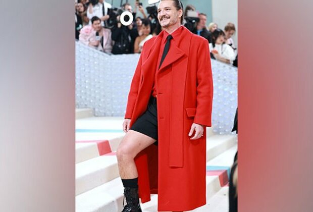 Pedro Pascal rocks red overcoat with black shorts look at Met Gala