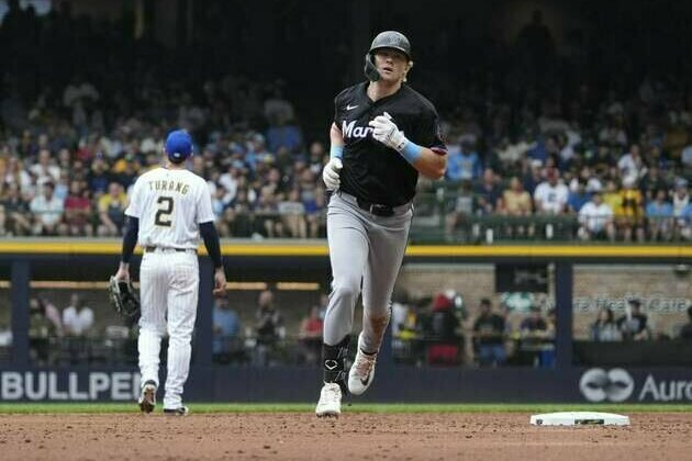 Marlins cool off Brewers to open series