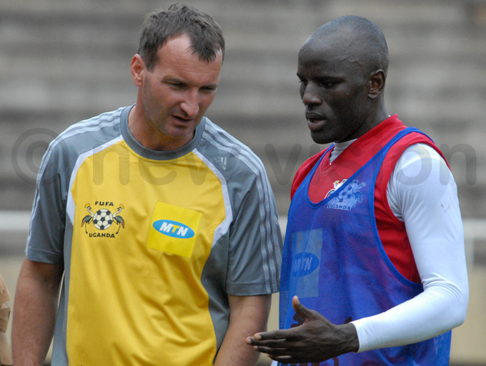  ranes coach aszlo saba chats with assa during a training session at amboole in une 2008 hoto by palanyi sentongo