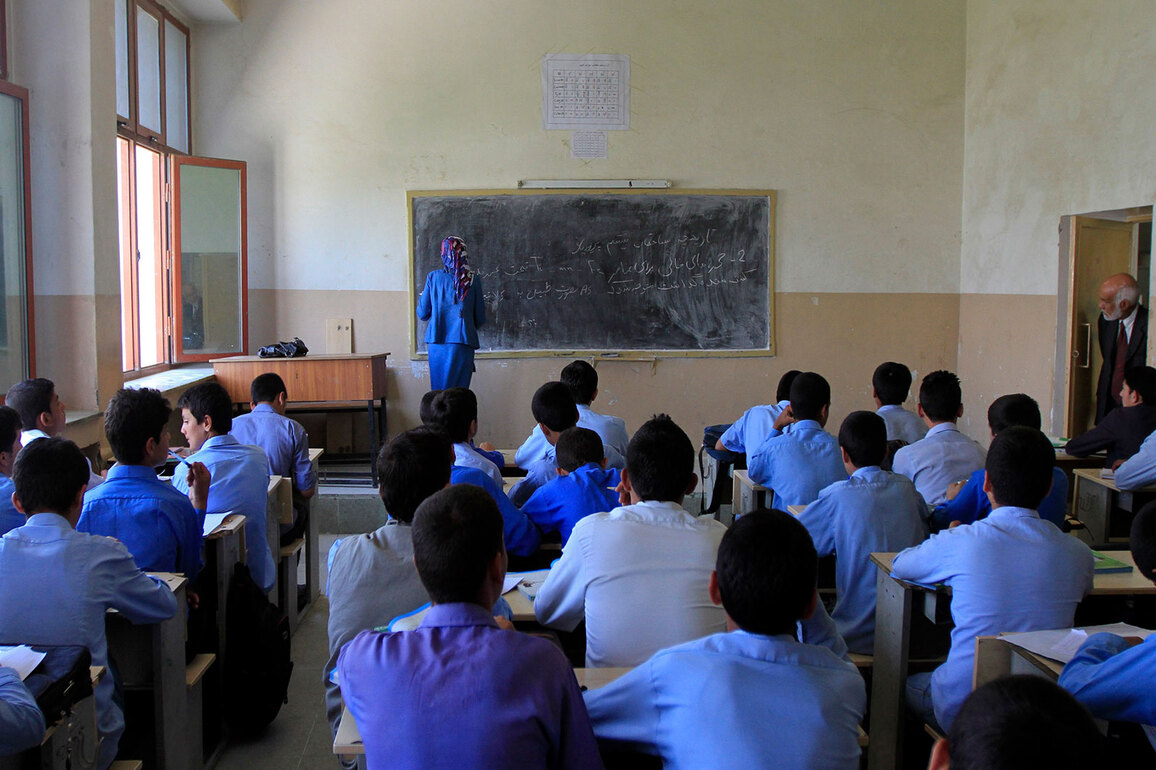 Bereft of buildings, Afghan students forced to attend school under sky