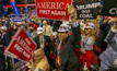 Trump supporters in West Virginia hold up pro-coal sign.