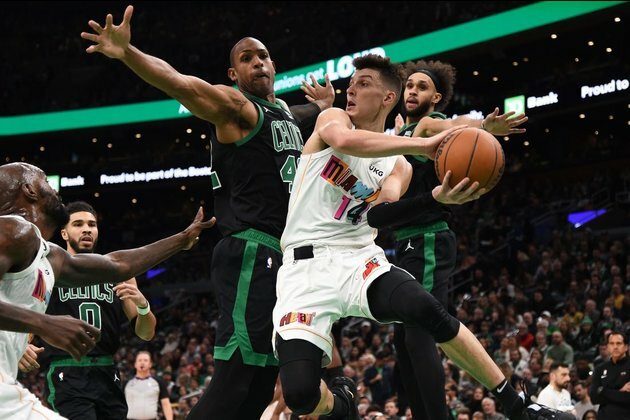 Jimmy Butler's return boosts Heat to OT win over Celtics