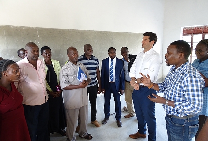 unavu right and ahony 2nd right interact with the school management team of utaraka rimary chool which got a facelift hoto by addeo wambale