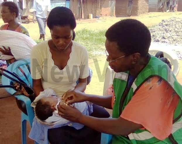  hildren being immunised during a health outreach in utembe village hoto by elson iva