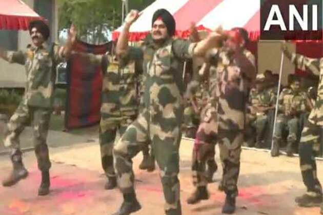 BSF personnel celebrate Holi at borders in West Bengal, Punjab, and Tripura