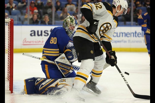 Bruins score four in first, rout Sabres