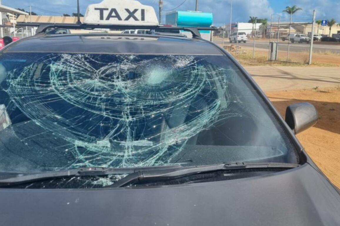 A 24-year-old Karloo man charged with allegedly smashing a taxis bonnet and windscreen