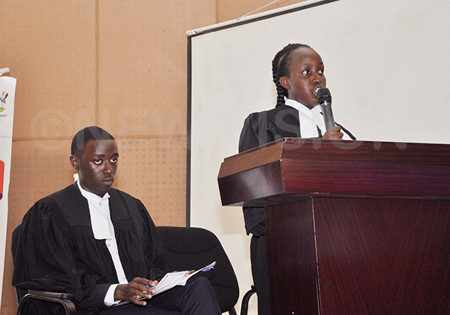  ome of the law students from ganda hristian niversity speaking to the judges during the interuniversity moot court competition 