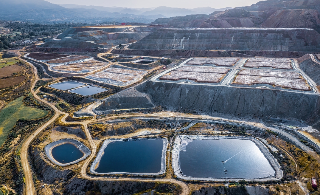 Leaching heaps and storage reservoirs at copper ore processing plant in Cyprus.