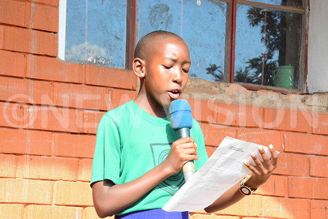  emimah ankabirwa reading a childrens memo about their rights