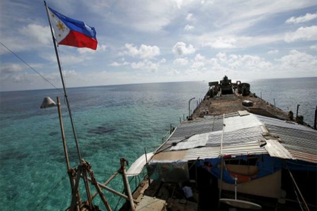 Philippines urges its fishermen to keep up presence at China-held shoal