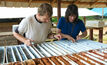 Geologists Kevin Pickett (left) and Anne Casselman working on core from the 2011-12 drilling campaign at Eagle Mountain