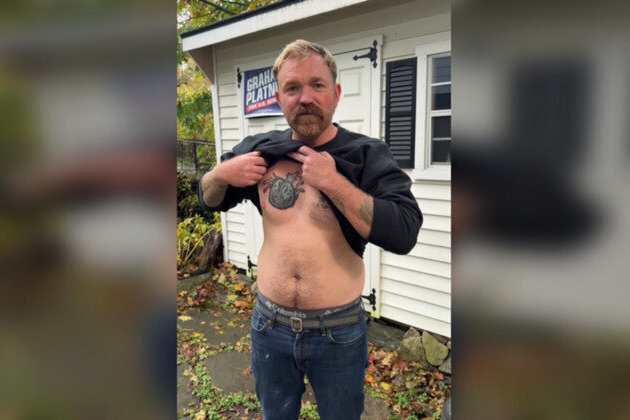 Former US Marine who covered up Nazi tattoo wins Democratic primary