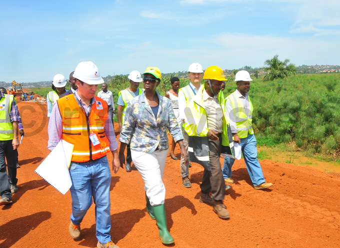  agina 2nd  inspecting the road works on orthern bypass in ampala he construction has been affected by clearance of the land owners