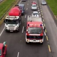 Motorists in Ireland protest fuel price rise by driving in convoys