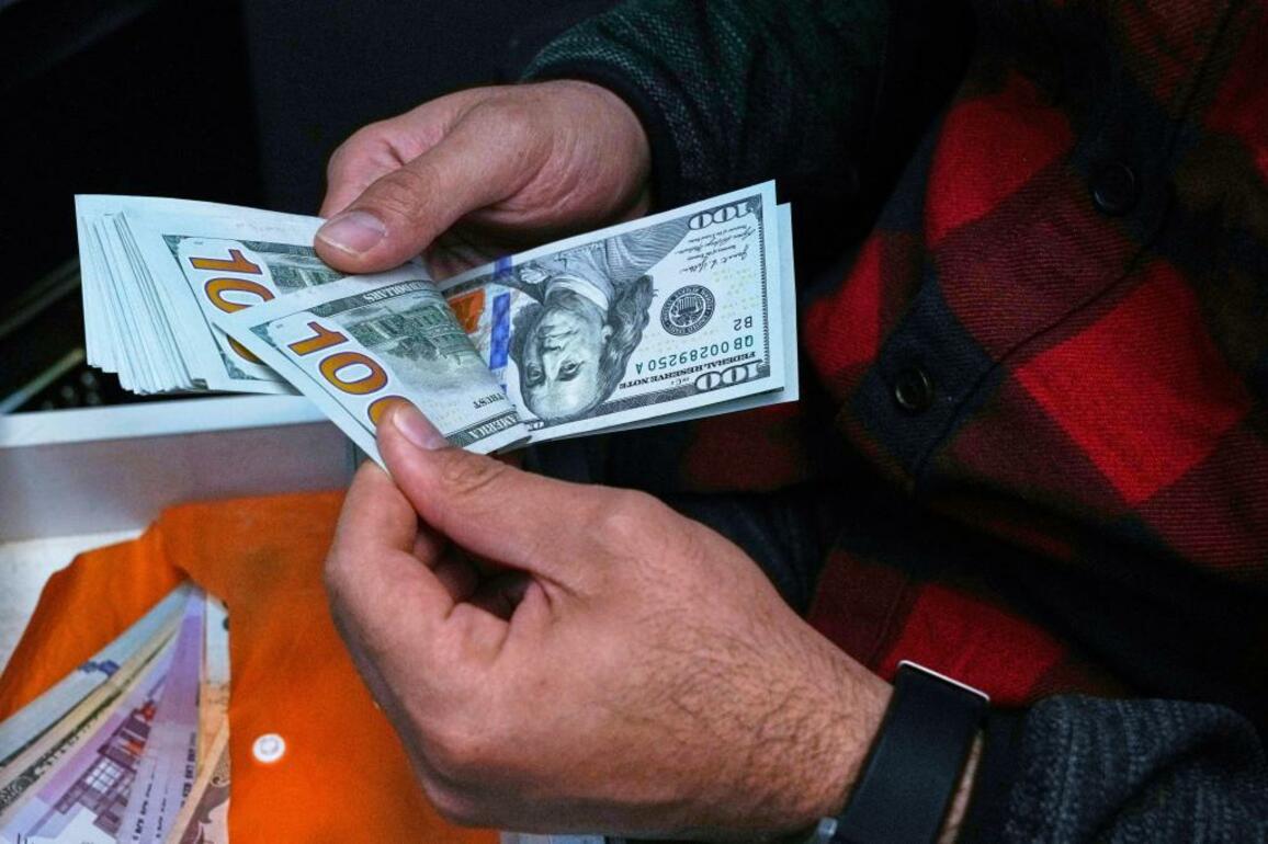 Irans currency falls to record low against dollar as tensions mount