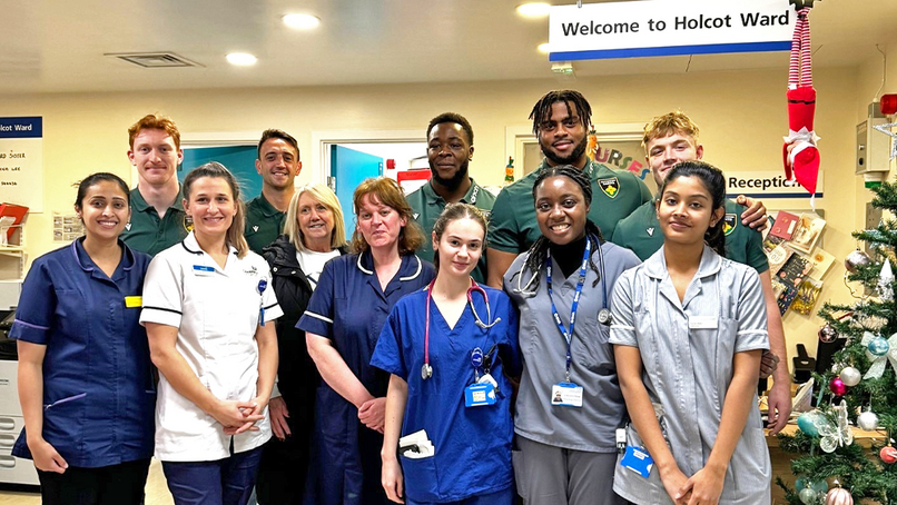 Northampton Saints George Hendy, Alex Mitchell, Emmanuel Iyogun, Chunya Munga, and Fin Smith with hospital staff last year.