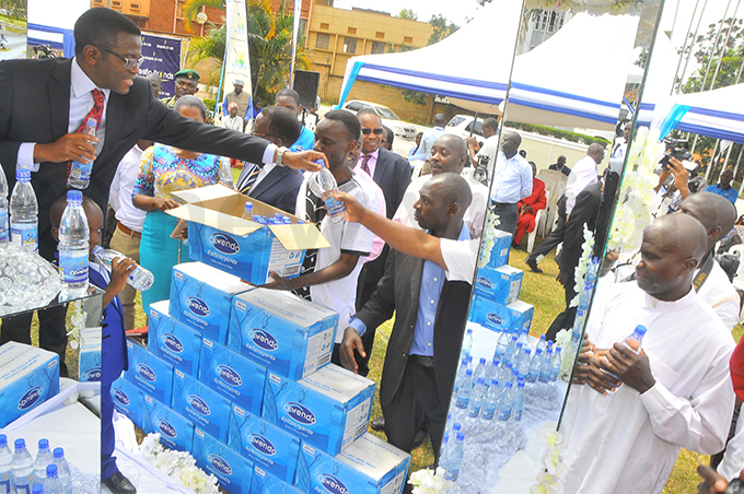 ayiga hands out water at the launch hoto by ilfred anya