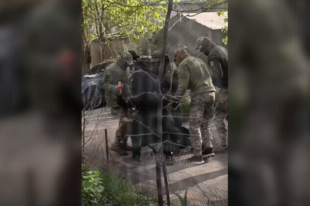 Ukrainian draft enforcers pepper-spray woman 