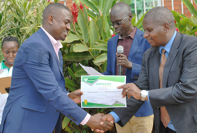  gynaecologist who took part in the training receiving a certificate hoto by gnes yotalengerire