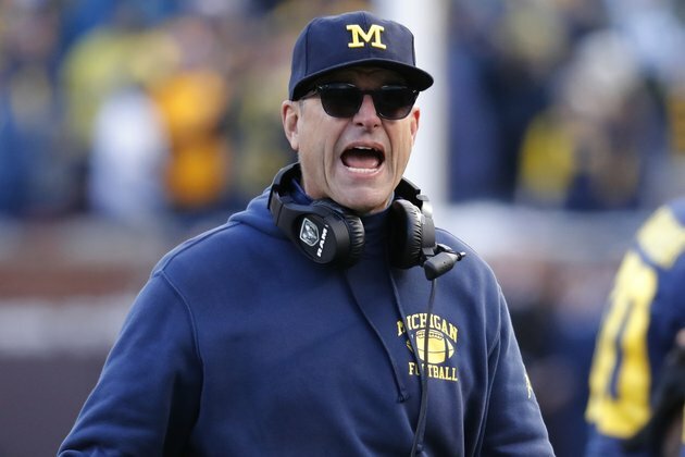 Michigan coaches Harbaugh, Howard accept pay cuts