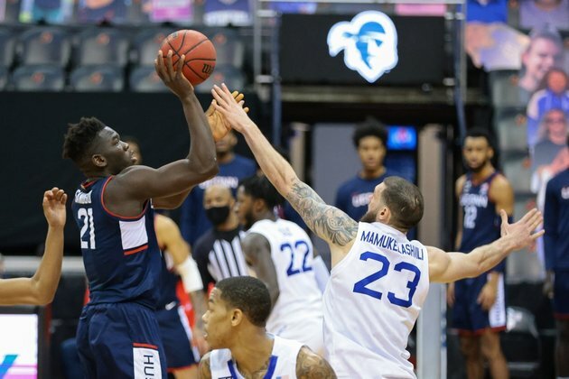Adama Sanogo helps No. 22 UConn beat No. 19 Auburn in 2OT in Bahamas