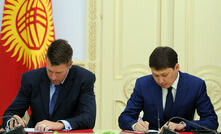 Close friends: Scott Perry and Sapar Isakov signing the truce that will cost Centerra $57 million this year