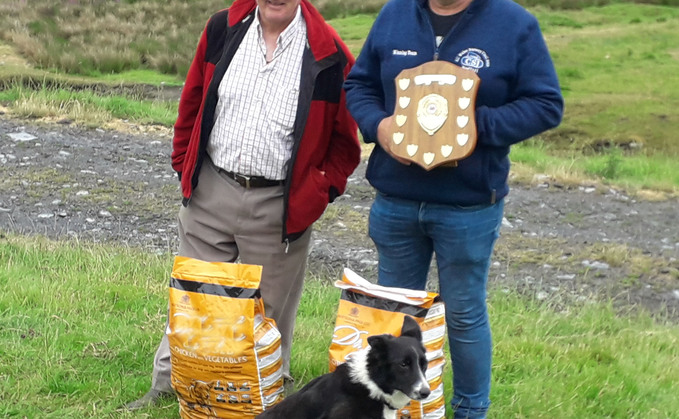 David Howells (right) and Wyverne Pip were crowned champions at Berwyn. Pictured with John Roberts, who presented a prize for the best outruns. 