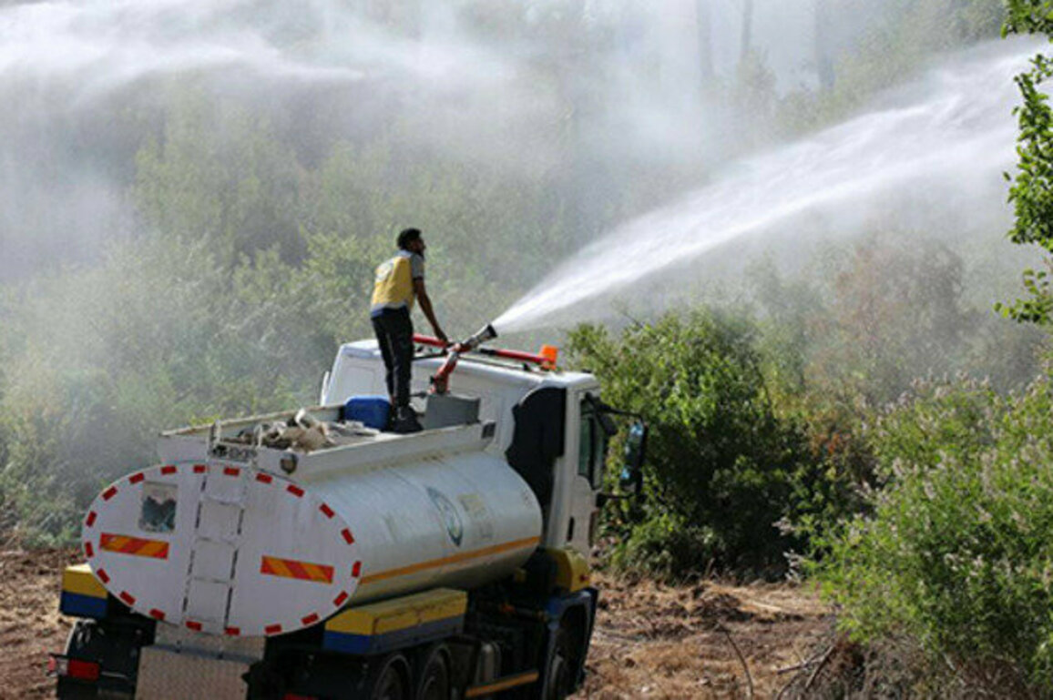 Firefighters control a fire in Qastal Maaf, Latakia