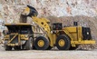A Cat 994K wheel loader loads a Cat 793F mining truck