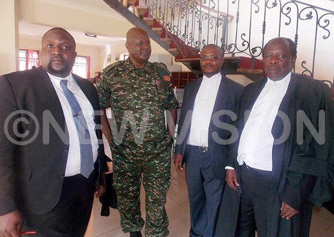 eft to right uis wanga awyer amuel erwangaawyer t ol umma eikosurety and ohn osco uddeawyerat the ntiorruption ourt in ampala  hoto by ohn ichael deng