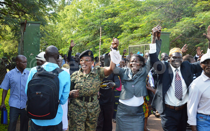    solider joins her retired colleagues in jubilation as they marched out of the quarter guard of the barracks 