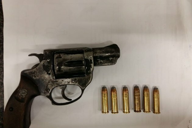 Man found in possession of stolen gun after allegedly chasing woman