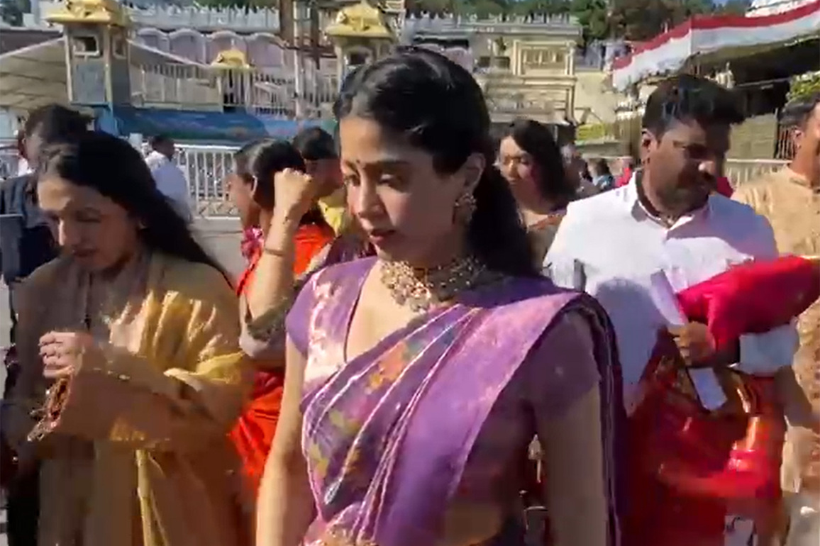 Dressed in traditional purple silk saree, Janhvi Kapoor seeks divine blessings for 'Peddi' at Tirumala temple