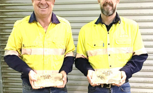 Mincor’s general manager of operations Paul Darcey and Goldfields Technical Services mine manager Rod Owen with Mincor’s first gold bars from Widgiemooltha.