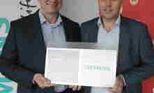 Siemens' Michael Freyny and Motorola's Martin Chappell seal the deal