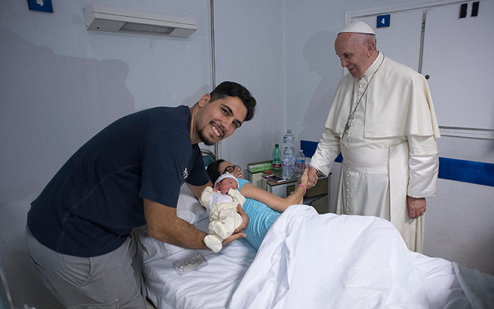 ope rancis shaking hands with a patient during his visit to the neonatology ward of an iovanni ospital in ome