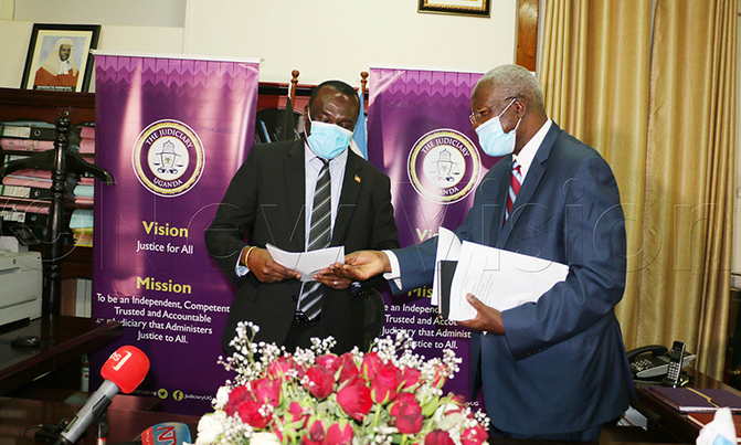 Katureebe hands over office to deputy Katureebe hands over office to deputy