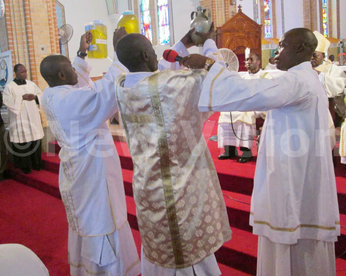  he eacons present the hrism oil during the hrism mass at ubaga athedral on hursday 