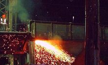  A worker using a thermal lance to cut a railway bridge.