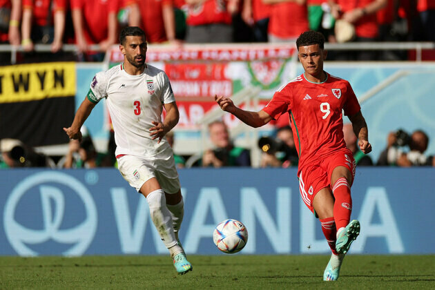 Iran beats Wales with two stoppage-time goals