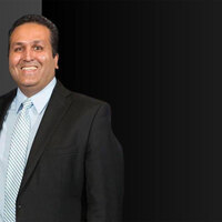 Ajay Jain Bhutoria slams new USCIS policy forcing Green Card applicants abroad